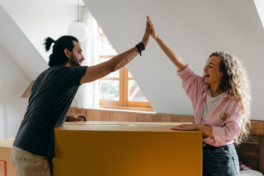 excited couple in their new apartment