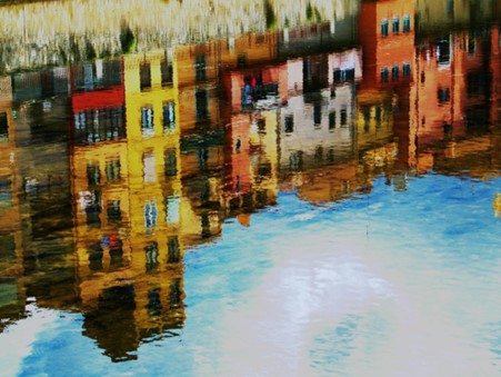 A reflection of a Spanish city in water