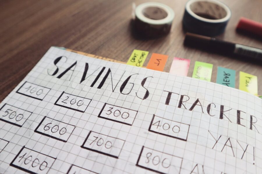 A hand-written “savings tracker” with numbers